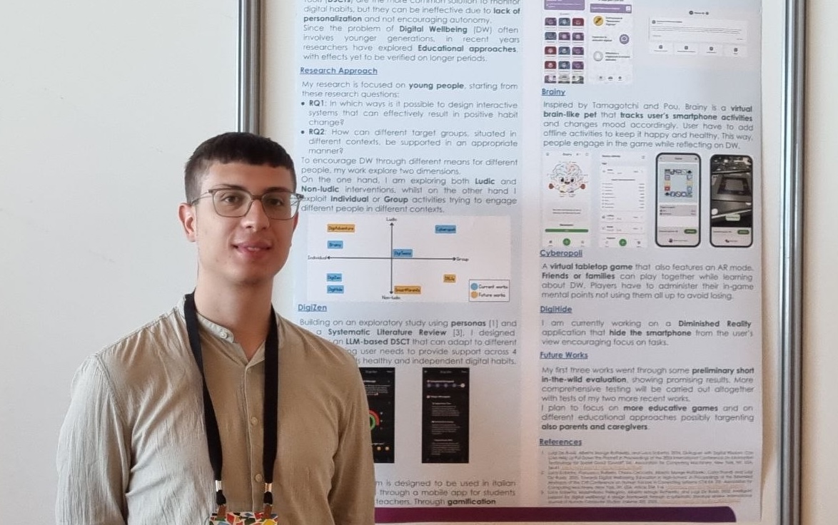 Luca presenting the poster about his work